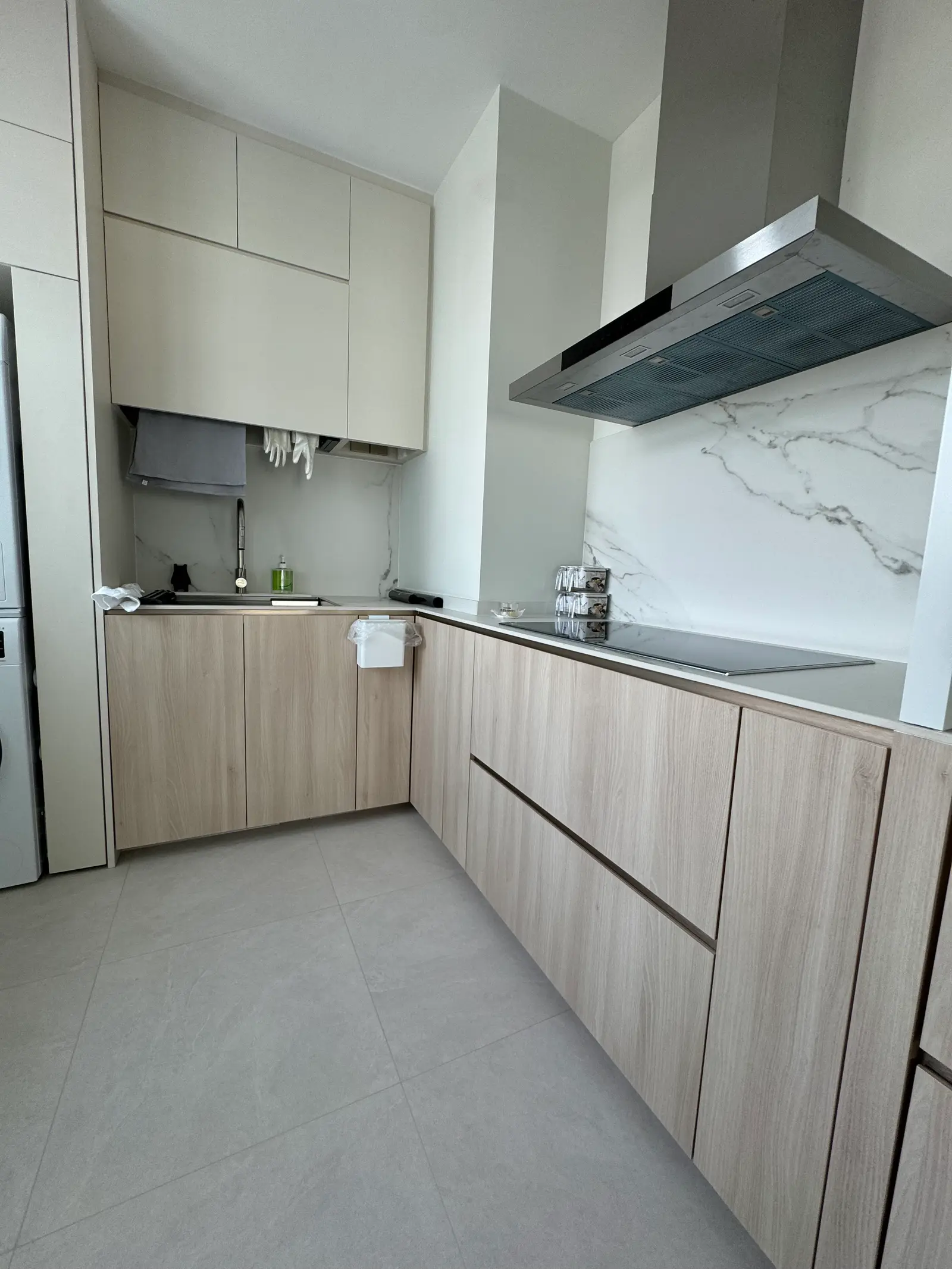 Pale oak corner kitchen with white wall cabinets